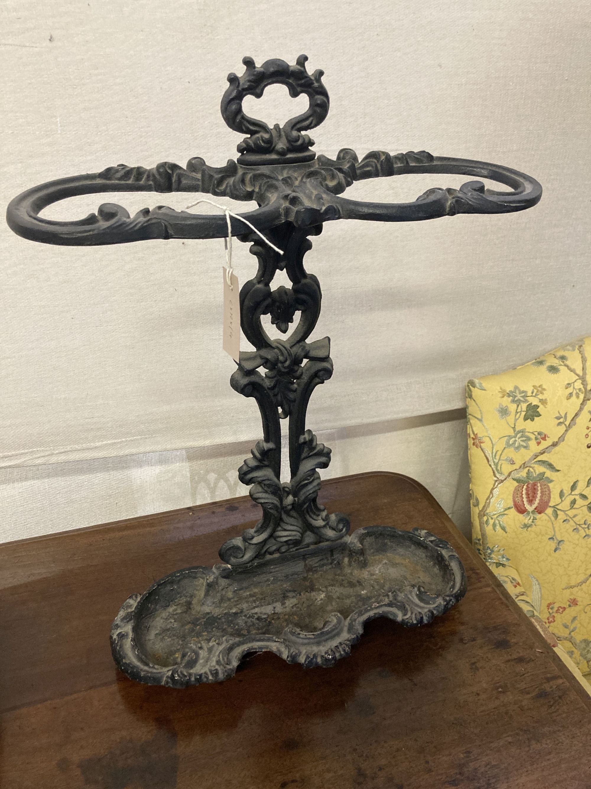 A Victorian style black painted cast iron stick and umbrella stand, width 45cm, depth 18cm, height 63cm